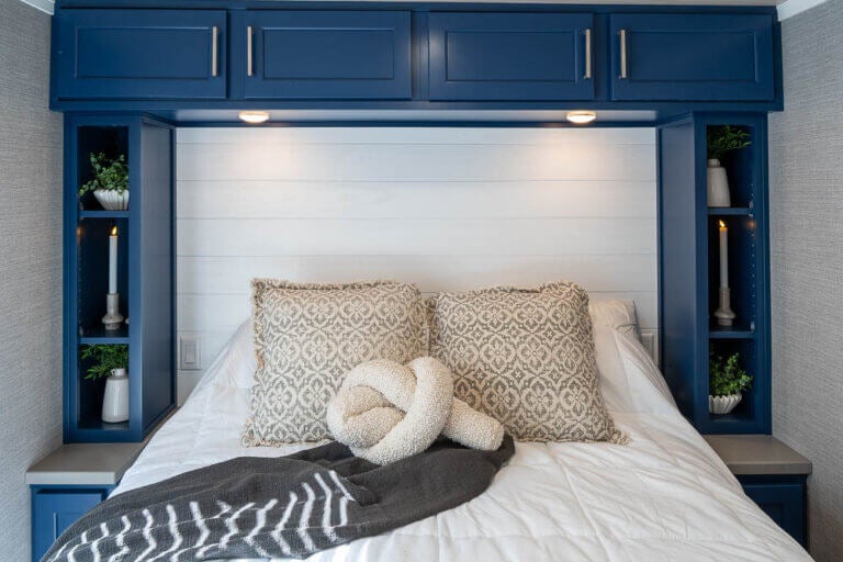 Inside the primary bedroom of an Elevation park model cabin at Sebago Lake at Point Sebago Resort.