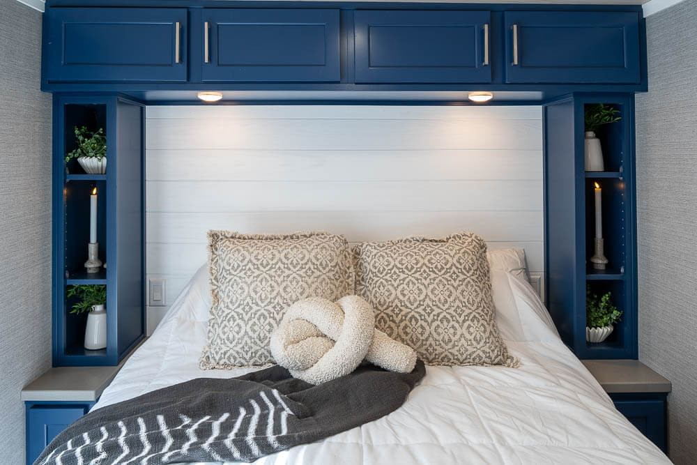 Inside the primary bedroom of an Elevation park model cabin at Sebago Lake at Point Sebago Resort.