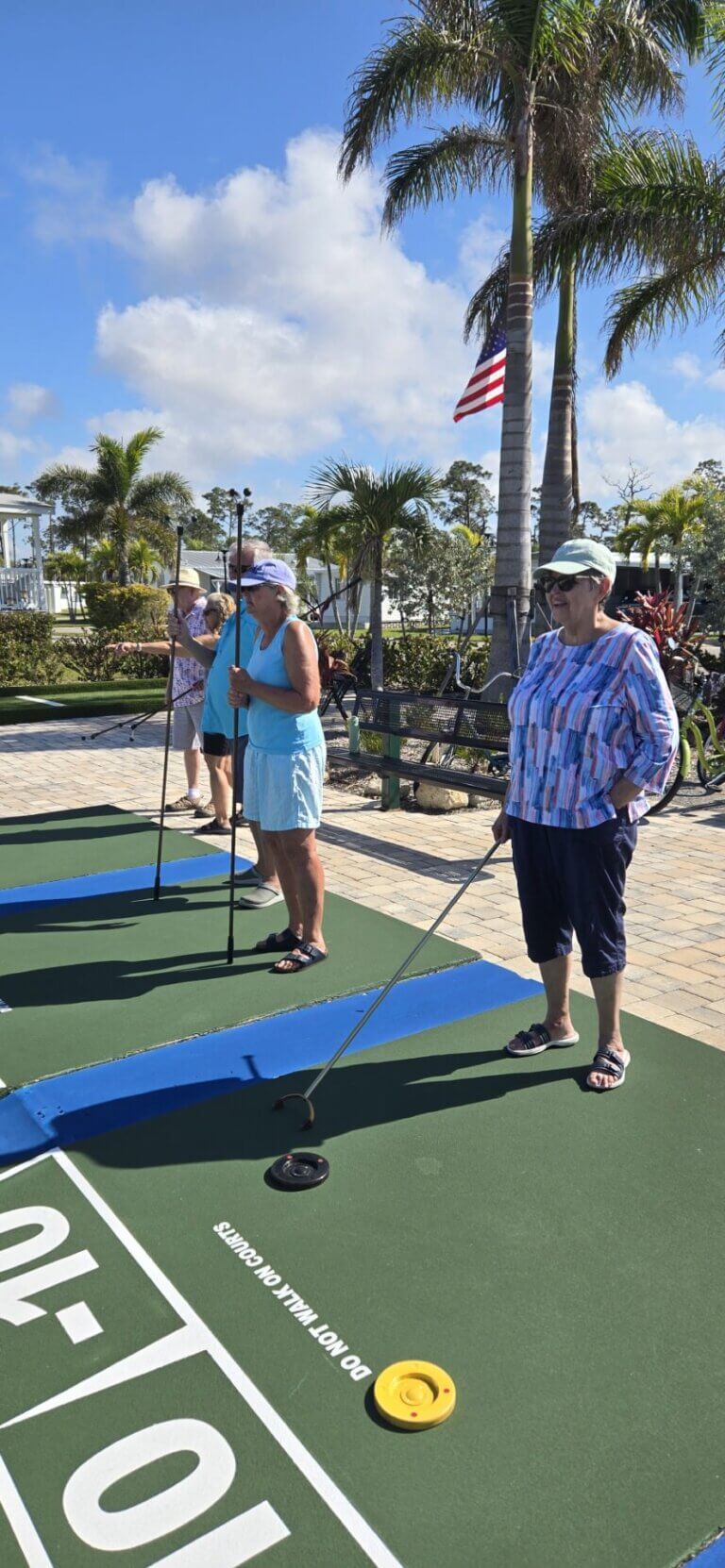 Women playing shuffleboard at Estero Bay Village in Florida.