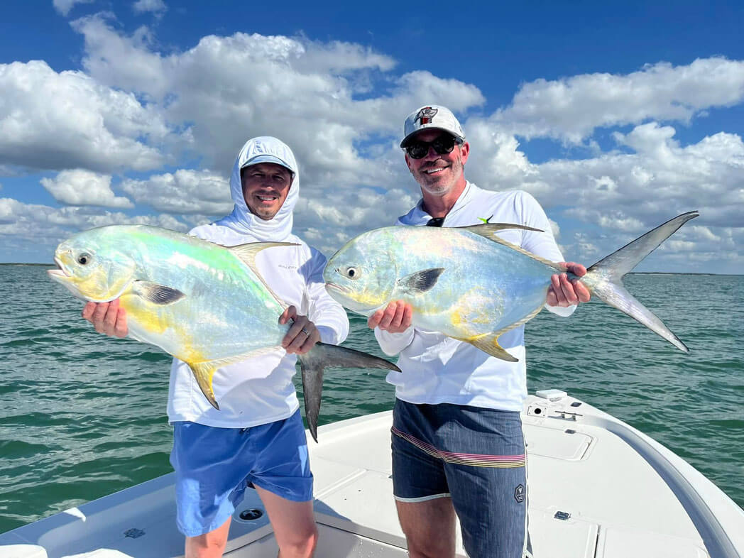Two men holding up fish they caught near Chokolosokee RV Park in Florida.