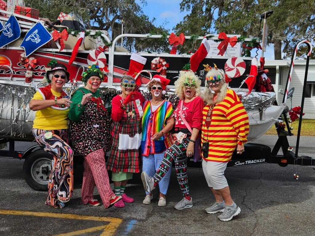 Holiday Clowns Club and their decorated boat during the Holiday RV Park Christmas golf cart parade in Leesburg, Florida.