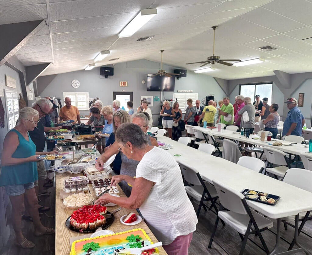 Residents at community potluck at holiday RV Park in Leesburg, FL