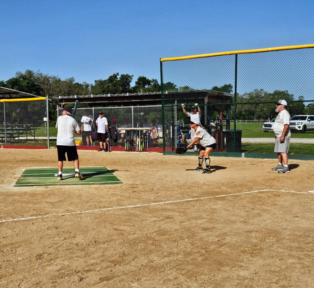Player up to bat in Holiday Softball game