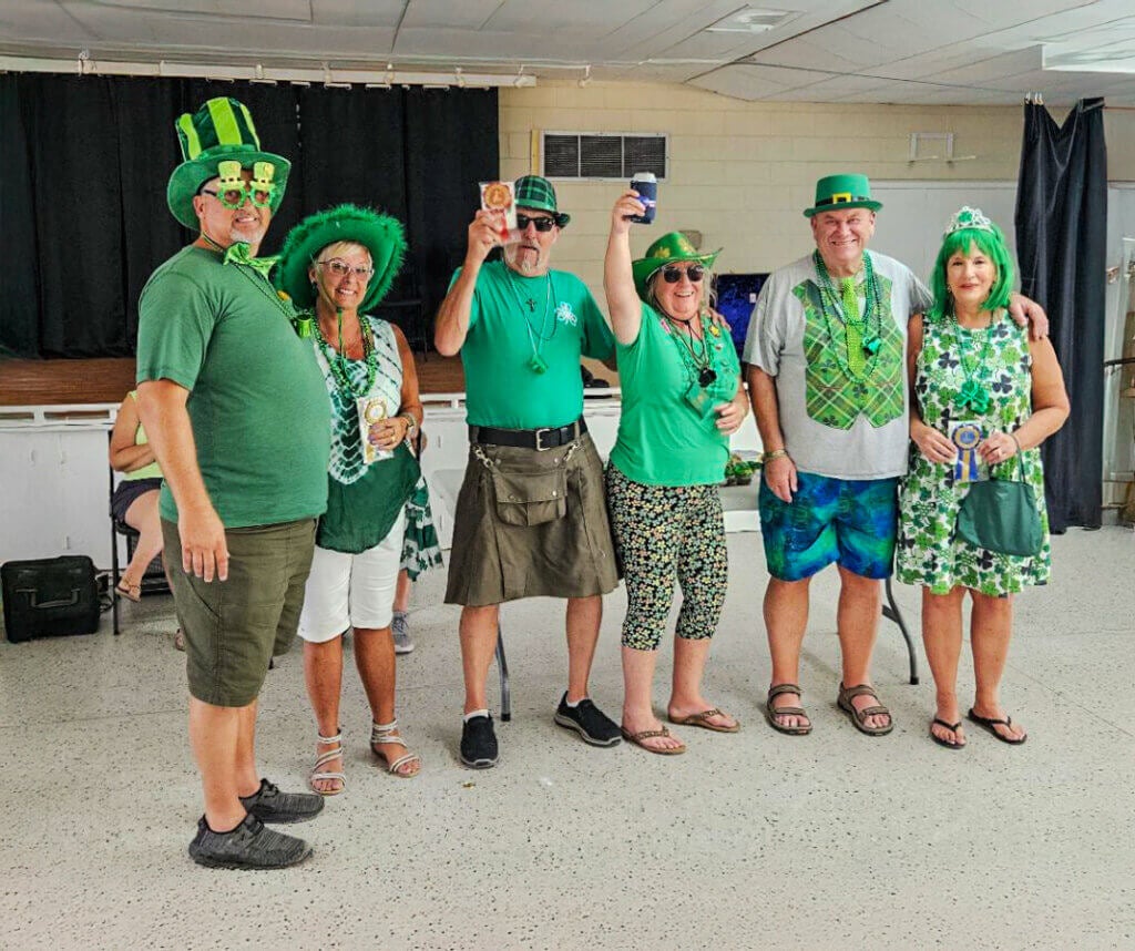 Guests at holiday RV Park in Leesburg Florida dressed up in green for the St. Patrick's day golf cart parade.
