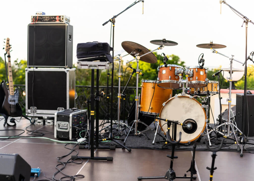 Instruments set up on stage for live music set, stock photo.