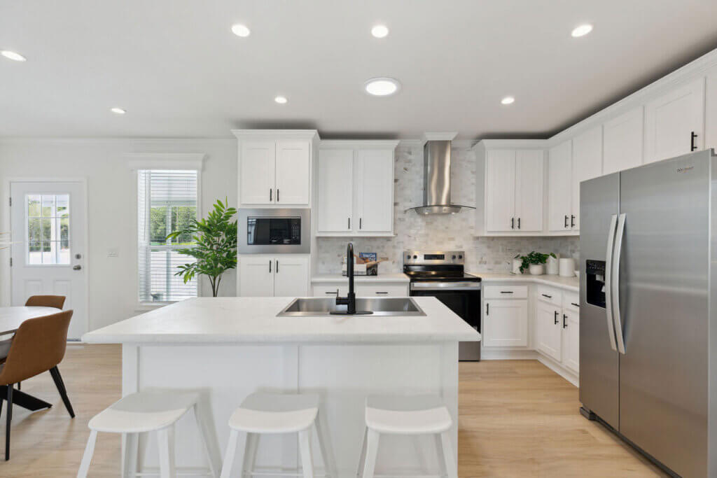 The kitchen view inside a staged manufactured home at Rolling Greens Village in Ocala, Florida.