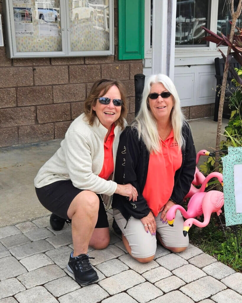 Lifestyle manager and their assistant outside the front office.