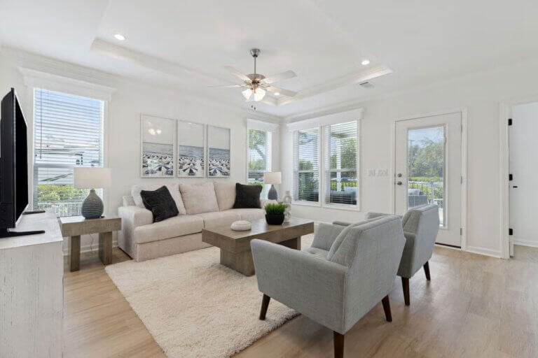 The living room view inside a staged manufactured home at Rolling Greens Village in Ocala, Florida.