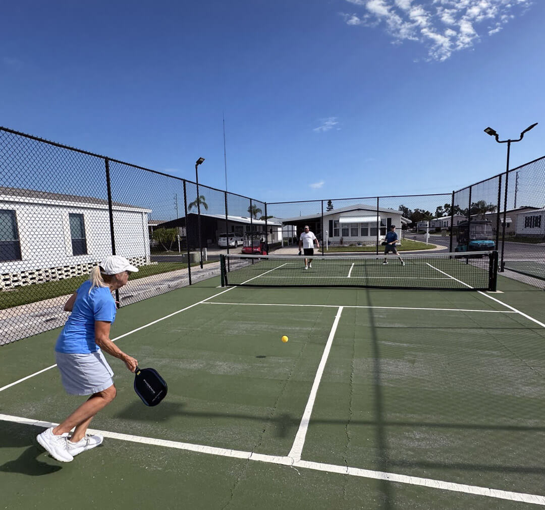 residents playing pickleball at the courts in The Meadows