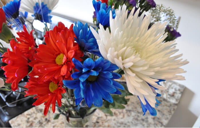 Red, white, and blue assorted flower arrangement.