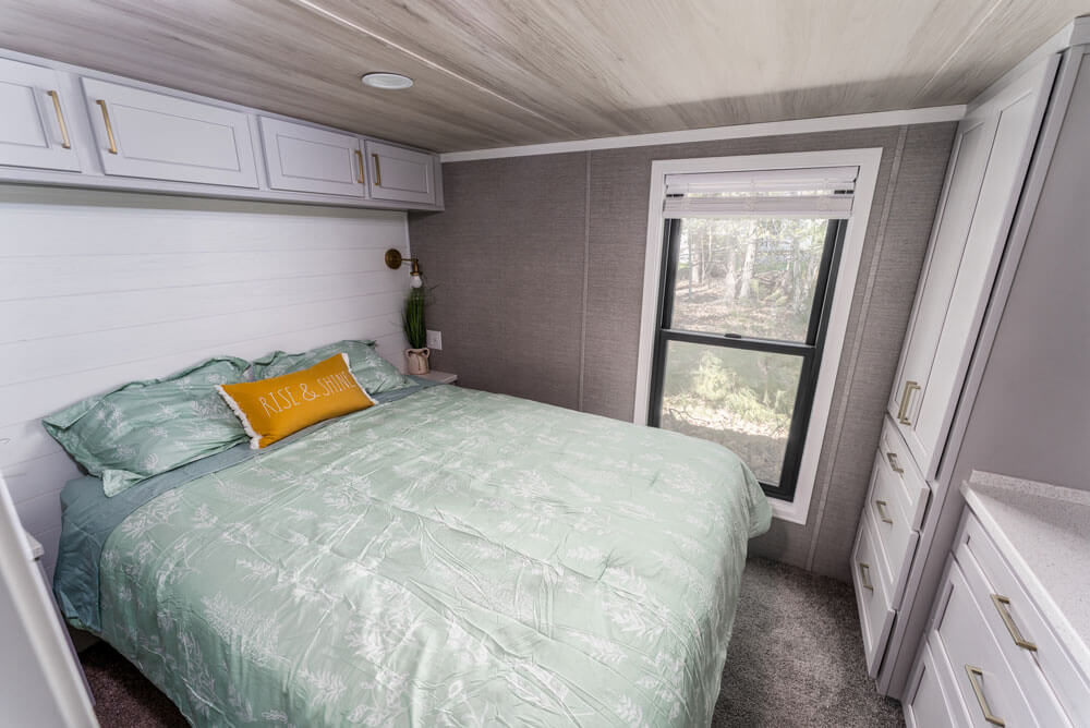 Bedroom inside the model cottage at Point Sebago. The photo shows an park model created by Elevation.