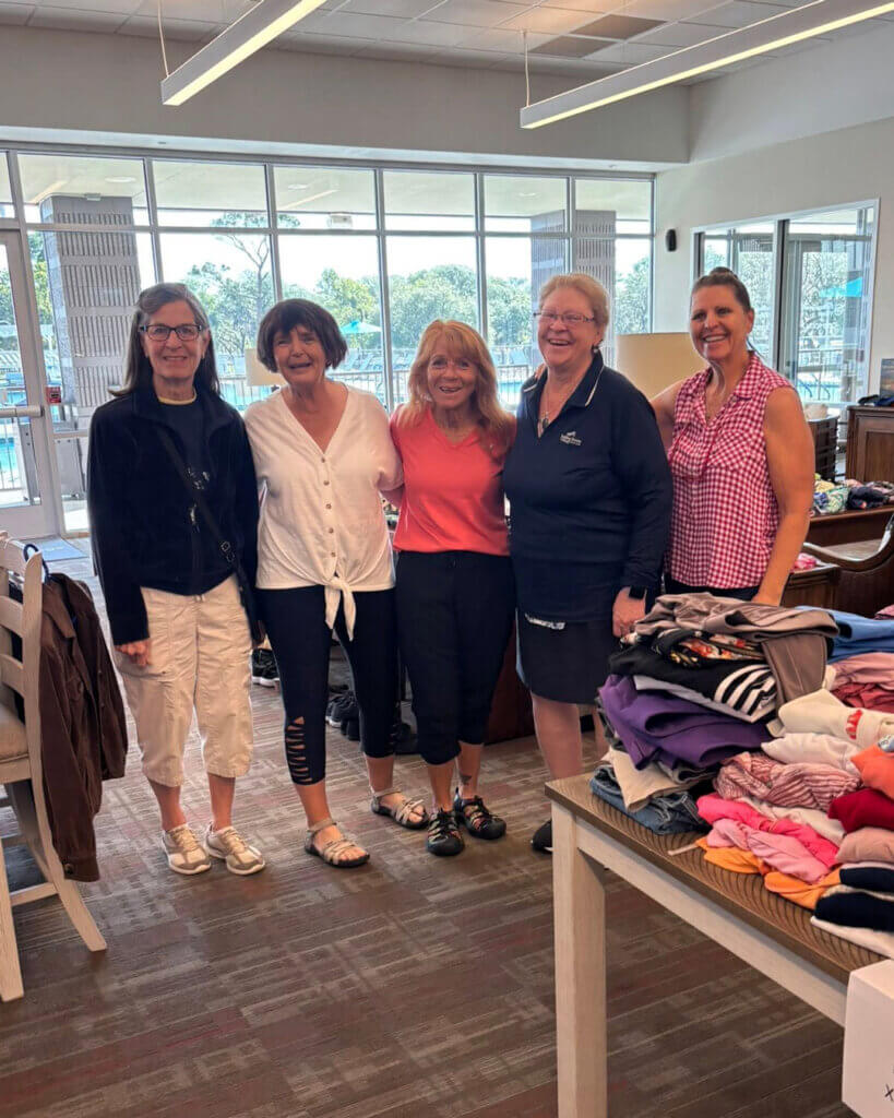 Residents at Rolling Greens Village participating in a community clothing swap.