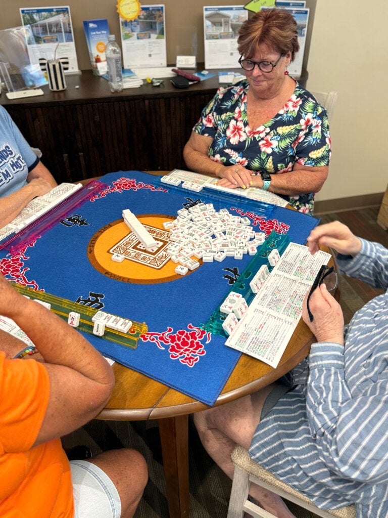 Women at Rolling Greens Village playing mahjong