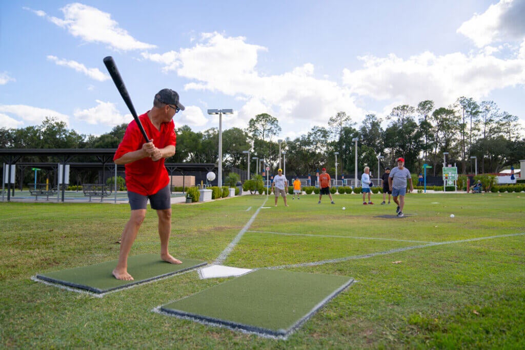 Man steps up to bat during a wiffleball game at Rolling Greens Village in Ocala, Florida.