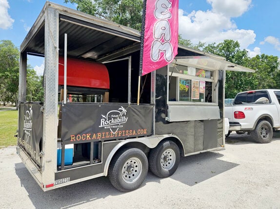 Rockabilly Wood Fired Pizza Food truck is parked at Holiday RV Park in Leesburg, Florida.