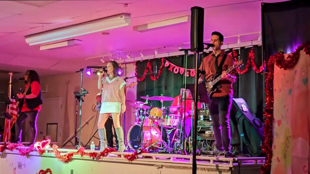 The Run Down Band performs live music on the activity center stage at the 2025 Holiday RV Park Valentine's dance.