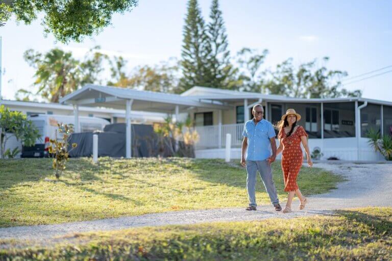 A couple walking along the path near homes at River Vista RV Park in Ruskin, Florida.