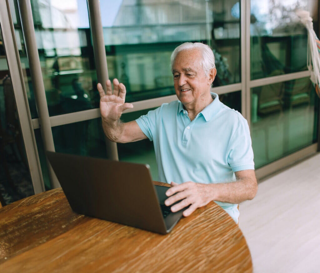 Senior man working on computer, stock photo.