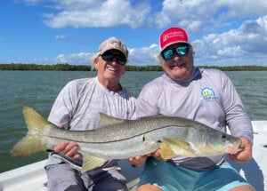 Captain Brian Sanders showing off a snook catch at Chokoloskee RV Park in Florida