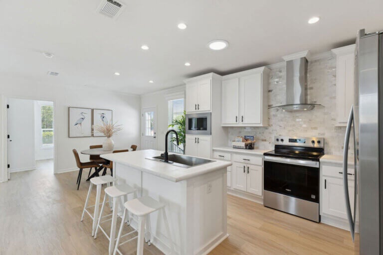 The kitchen view inside a staged manufactured home at Rolling Greens Village in Ocala, Florida.