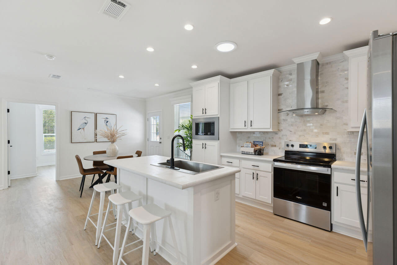 The kitchen view inside a staged manufactured home at Rolling Greens Village in Ocala, Florida.