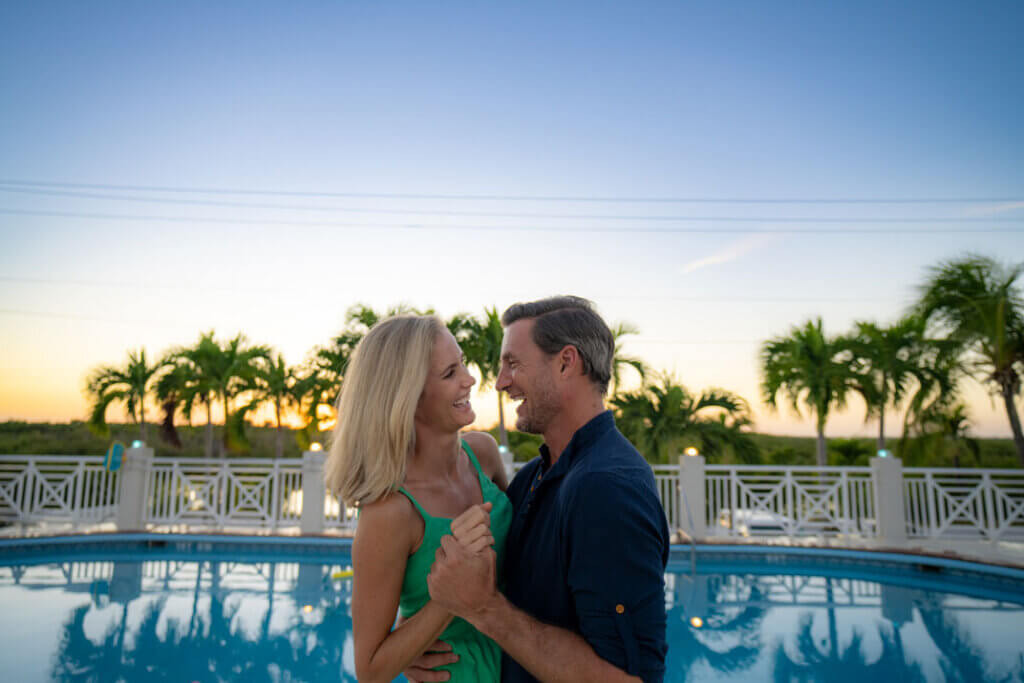 Couple dancing next to the rooftop swimming pool at Big Pine Key RV Park in Florida.
