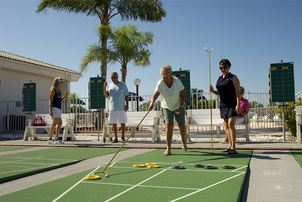 The Meadows - People playing Shuffleboard