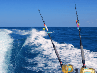 Stock Fishing Big Pine Key View of the back of the boat in the ocean while sailing with two fishing pools.