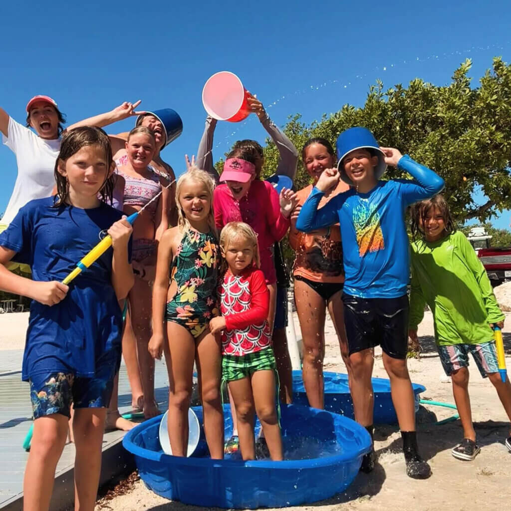 Kids playing with water guns and buckets at Big Pine Key Rv Park in Florida