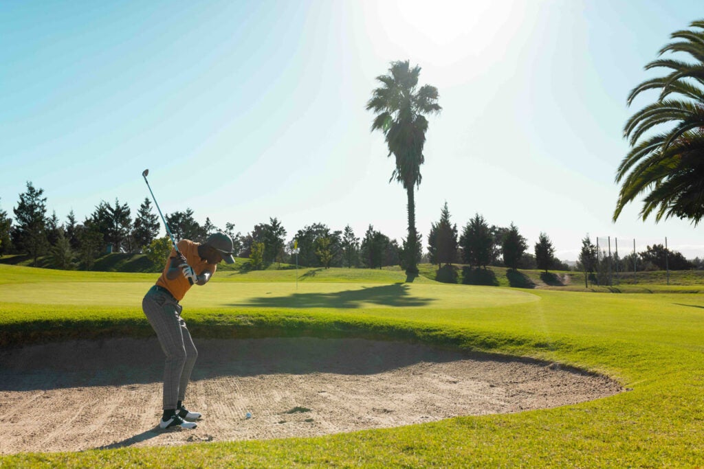 Golfer swinging a club in Florida