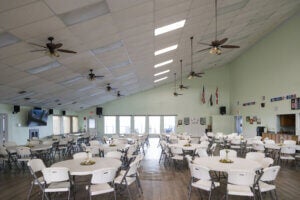 Tables and chairs inside the clubhouse at Lake Griffin Harbor Village in Leesburg, Florida.