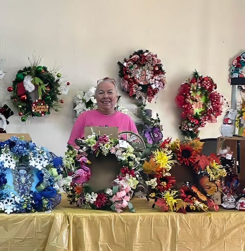 Resident selling handmade wreaths at a DAV fundraiser at The Meadows in Tarpon Springs, Florida.