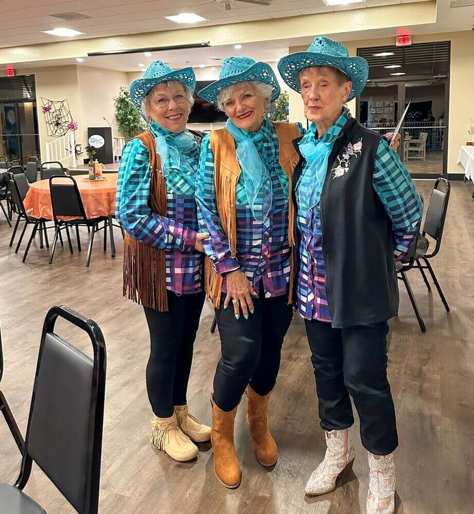 Residents dressed up as cowgirls for the Halloween Party at The Meadows in Tarpon Springs, Florida.