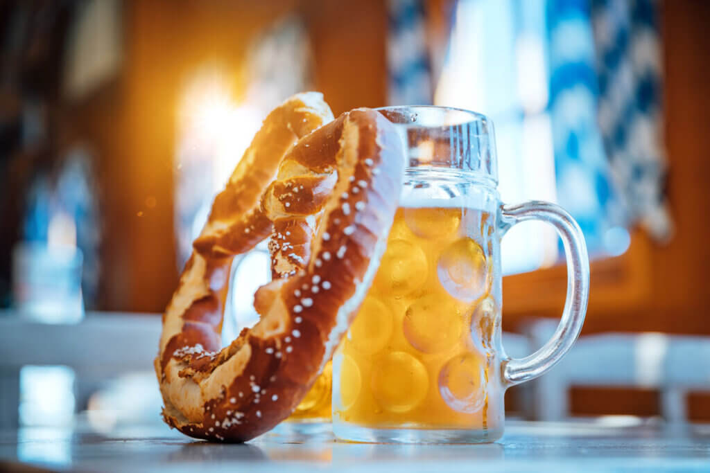 Beer and pretzel by Nikada from Getty Images Signature on Canva