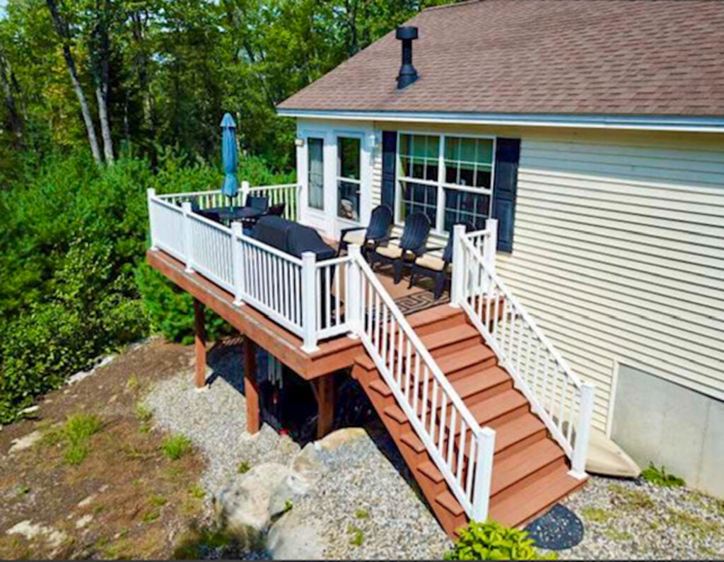 Exterior of home with deck and stairs