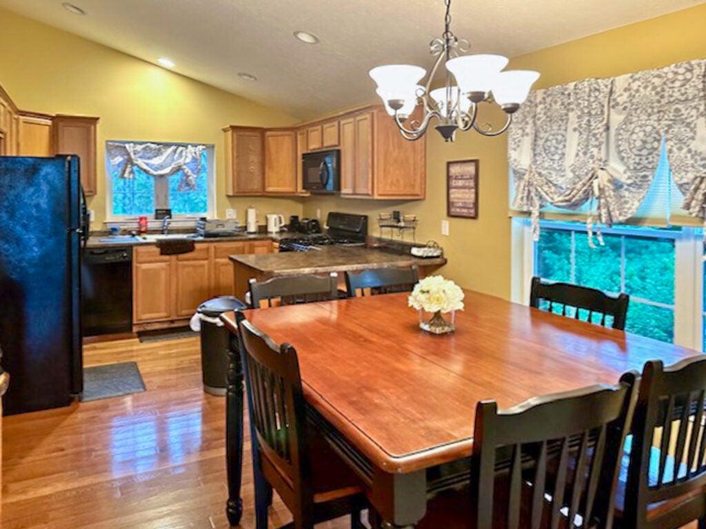 Kitchen with table and chairs in foreground