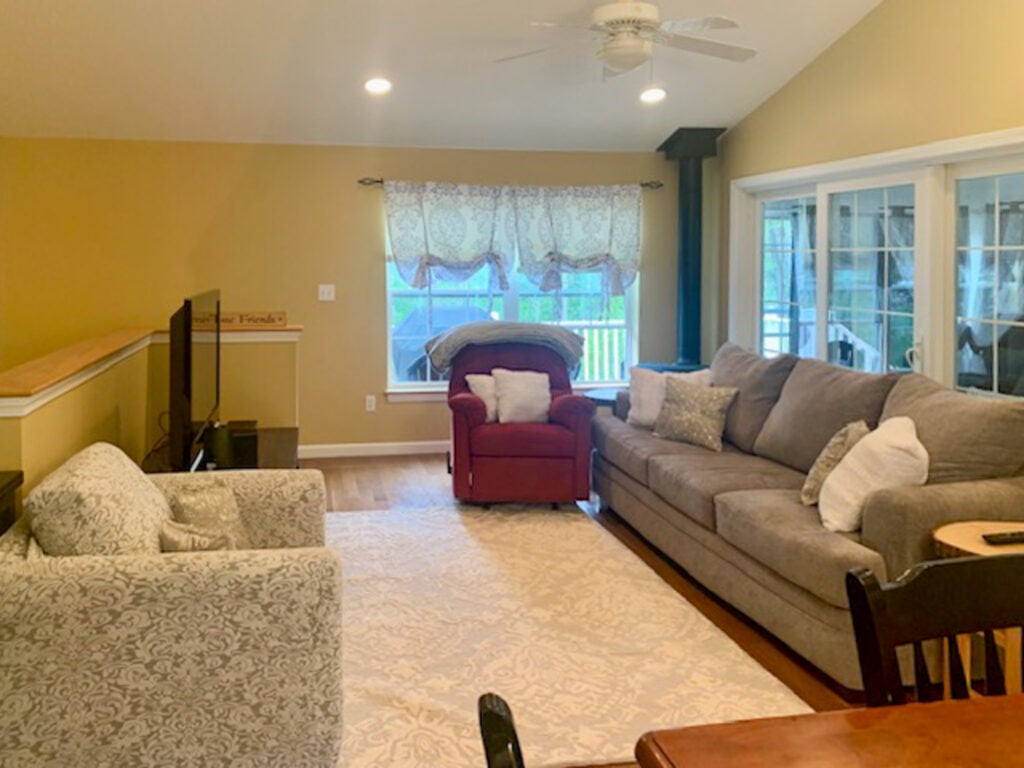 Living room with couch, armchair and television