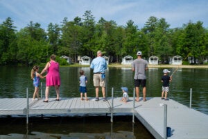 Ranger Rick fishing with kids on the lagoon at Point Sebago Resort in Maine.
