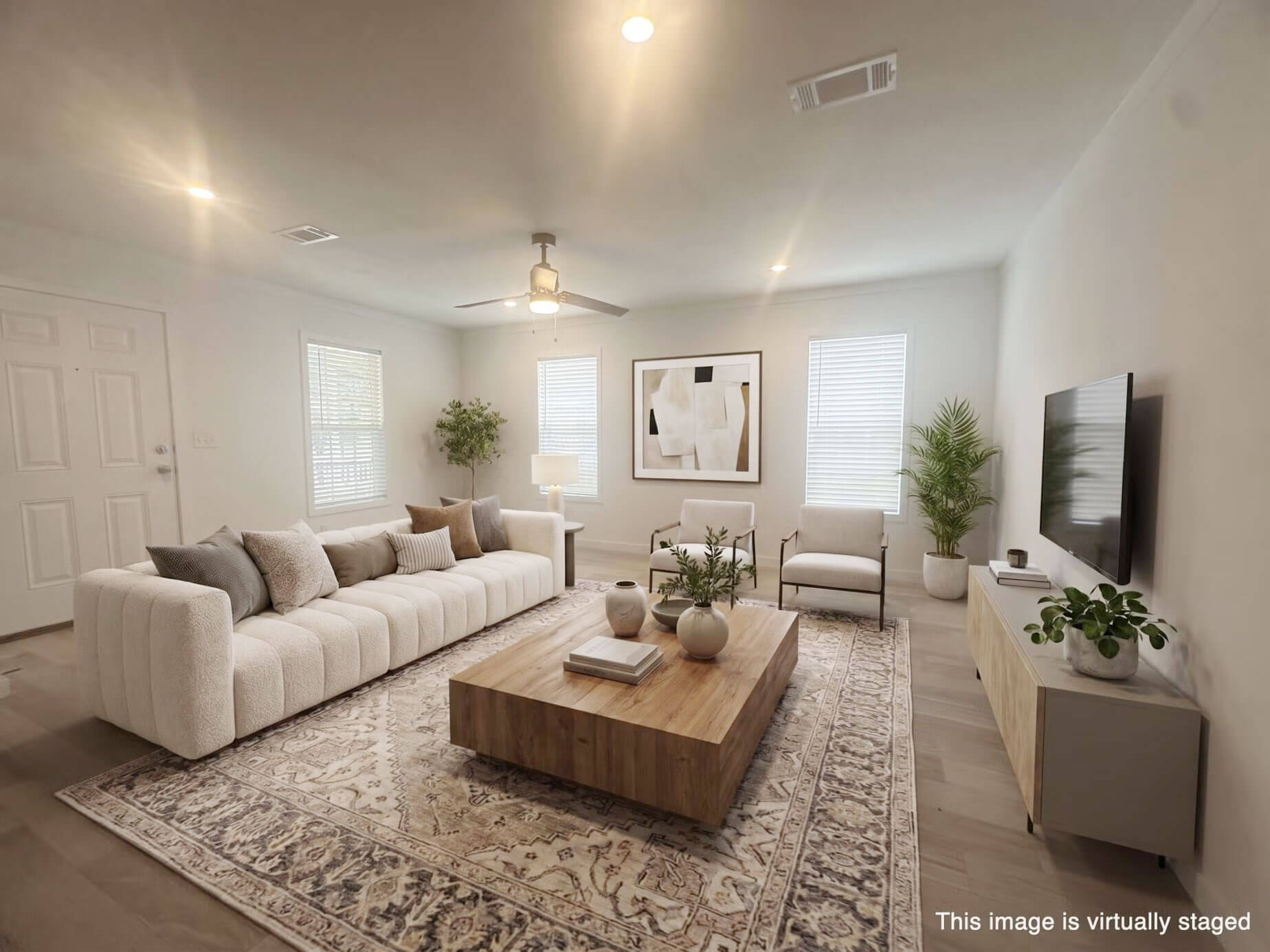 A virtually staged living room inside a manufactured home in StrawBerry Ridge Village.