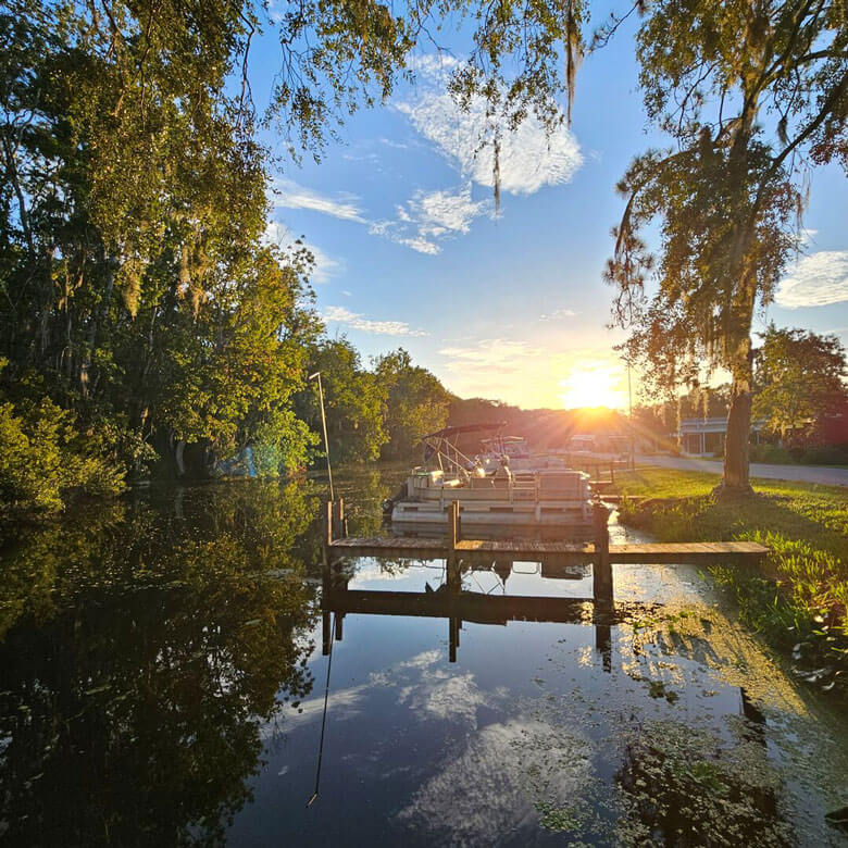The sunrise over the canal at Holiday RV Park in Leesburg, Florida.