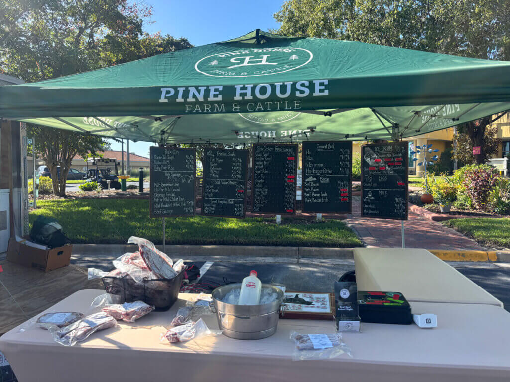 Pine House Farm & Cattle green tent at the Cypress Lakes Village Market.