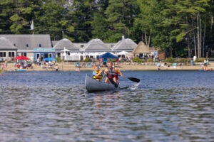 Man and kid in canoe