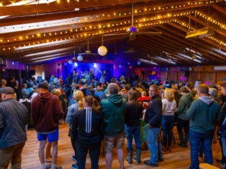 Crowd watching a band in a clubhouse at Point Sebago Resort in Casco, Maine.
