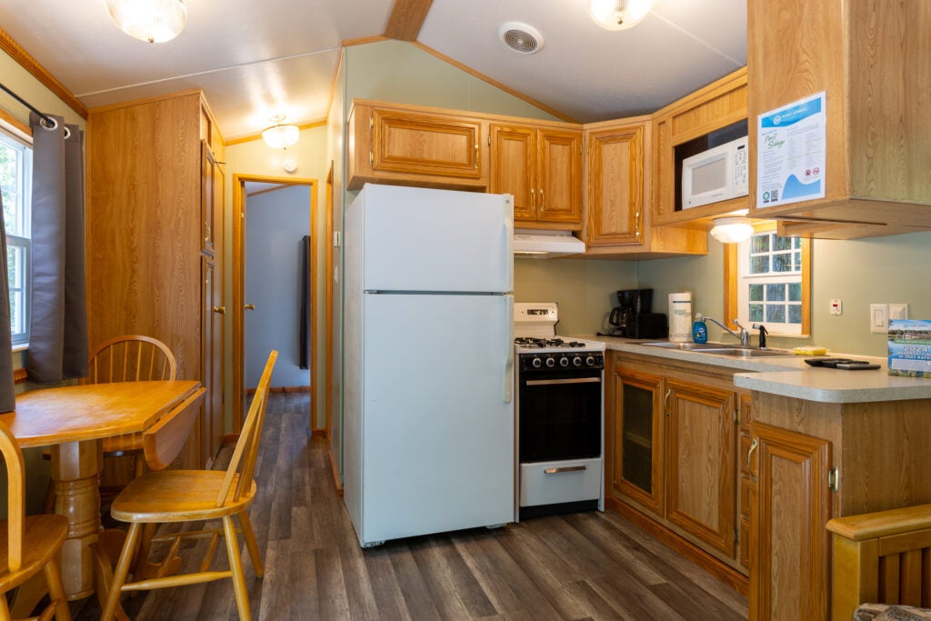 Kitchen of Basic unit with table and door to master bedroom