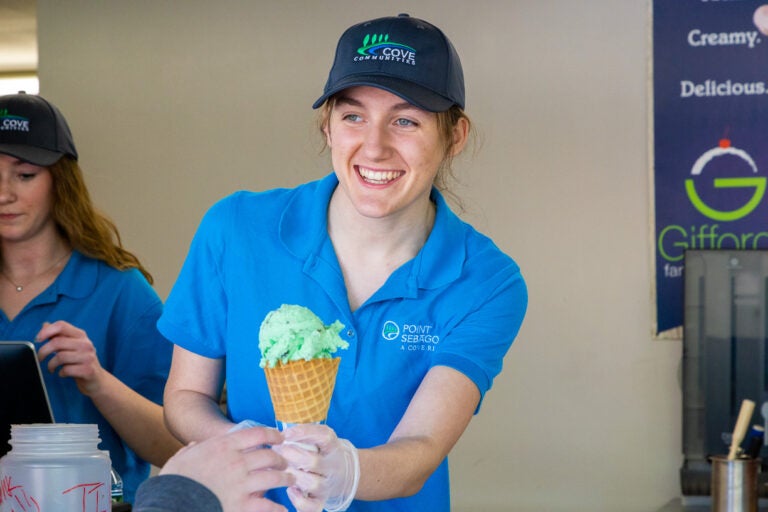 Woman serving ice cream cone