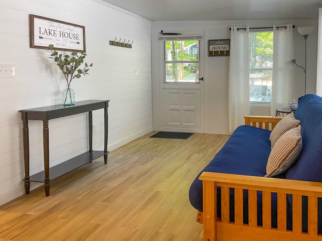 Living room with a futon and front door