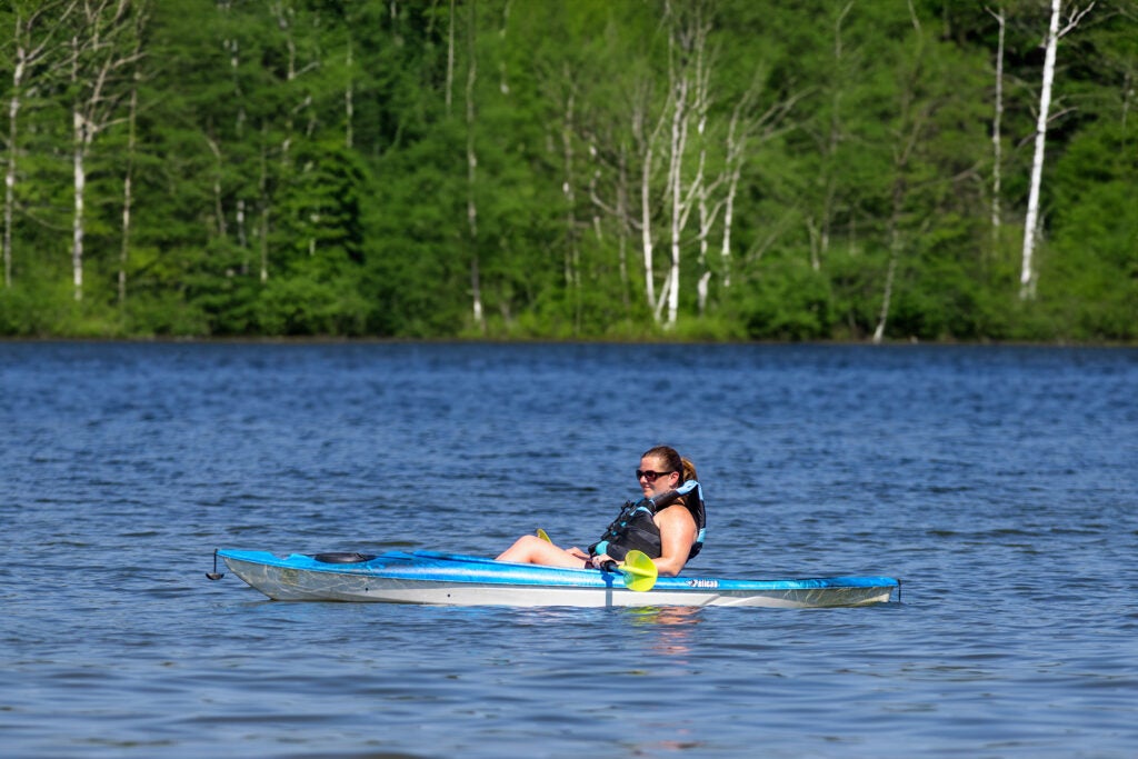 woman in kayak on lake