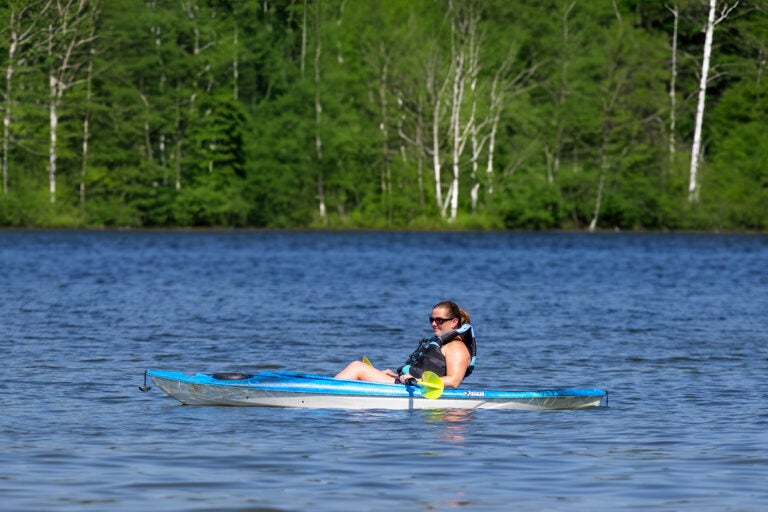 woman in kayak on lake