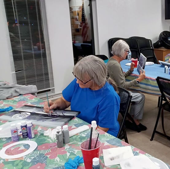 residents painting activity at Rolling Greens Village, a 55+ community in Ocala, Florida