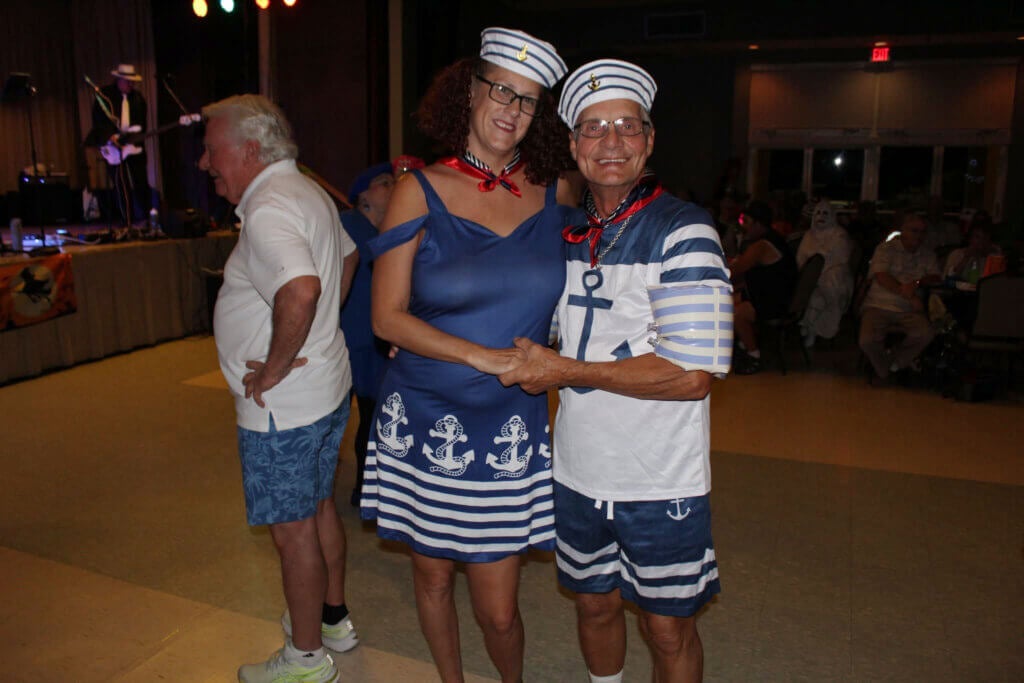 A couple dressed as sailors at the 2024 Halloween Dance at Cypress Lakes Village.